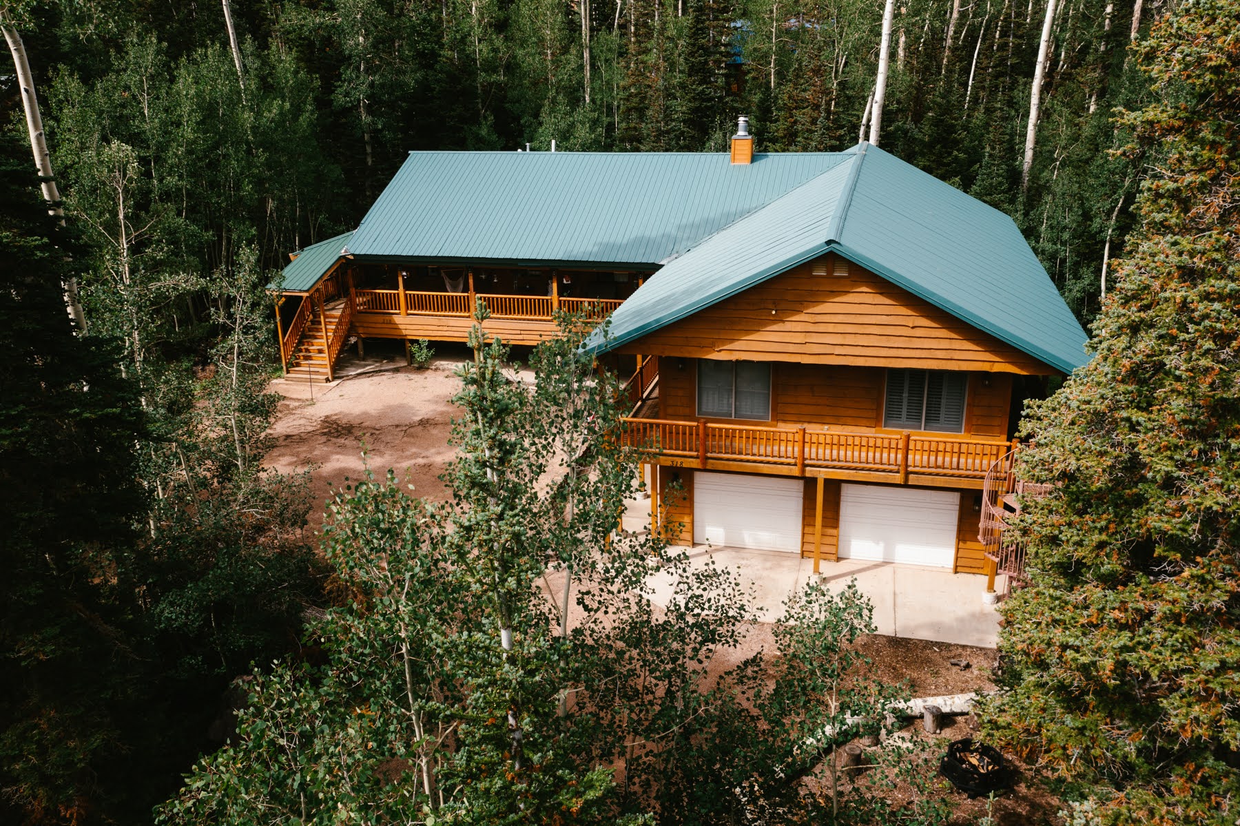 Utah cabin nestled in trees and mountains